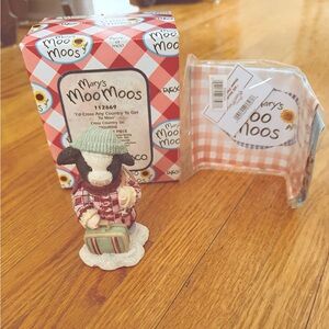 Mary's Moo Moos Cow Figurine titled "I'd Cross Any Country To Get To Moo"